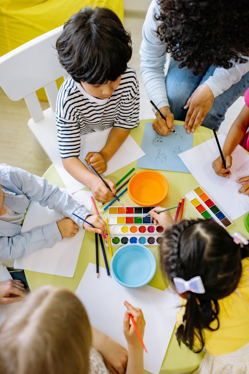 Children and teachers doing art